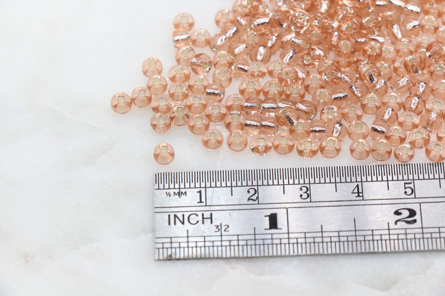 Transparent Glass Beads with Silver Lined, ideal for crafting jewelry such as bracelets and necklaces and other crafts.