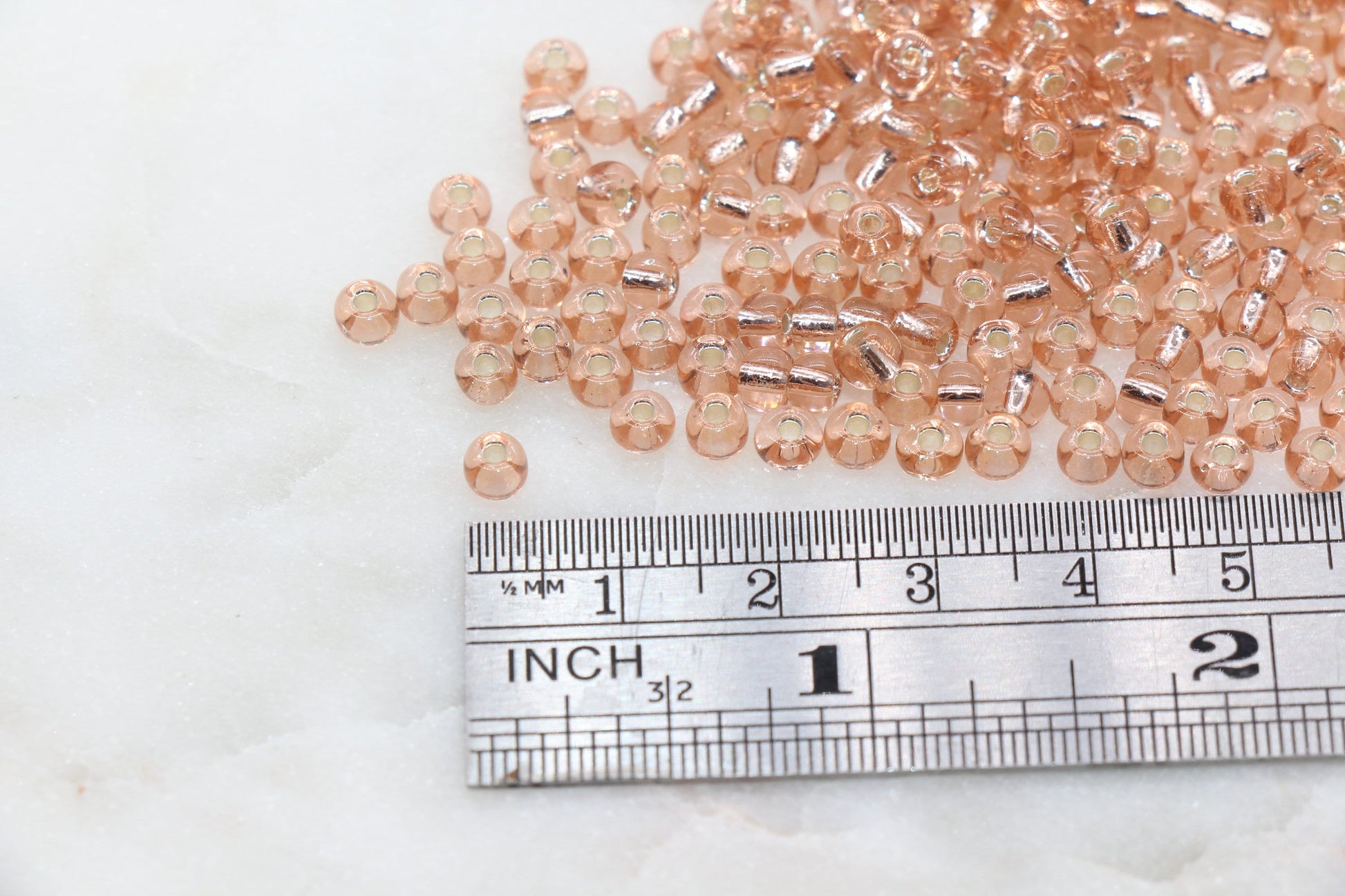 Transparent Glass Beads with Silver Lined, ideal for crafting jewelry such as bracelets and necklaces and other crafts.