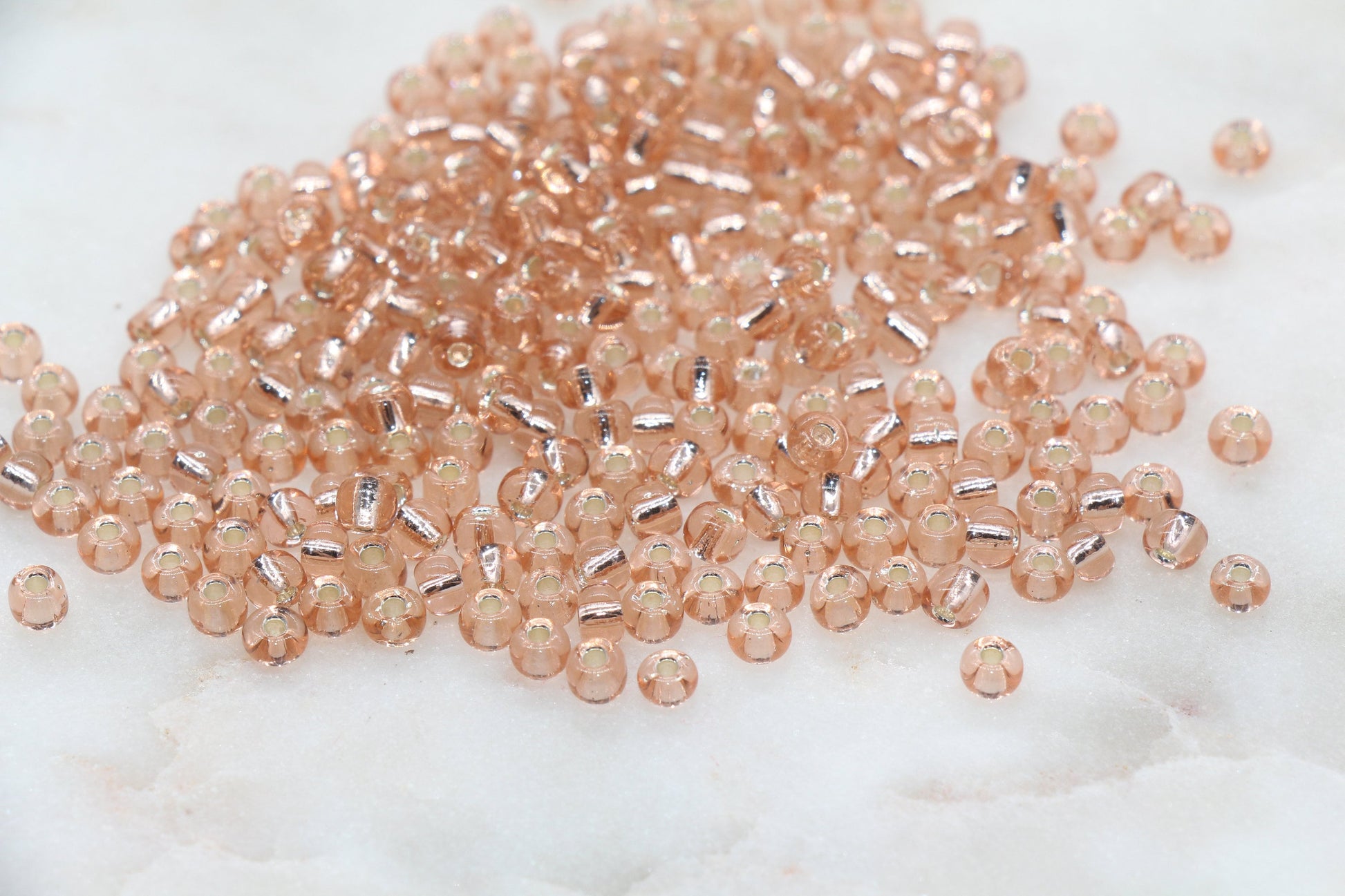 Transparent Glass Beads with Silver Lined, ideal for crafting jewelry such as bracelets and necklaces and other crafts.