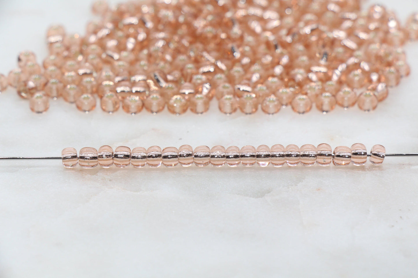 Transparent Glass Beads with Silver Lined, ideal for crafting jewelry such as bracelets and necklaces and other crafts.