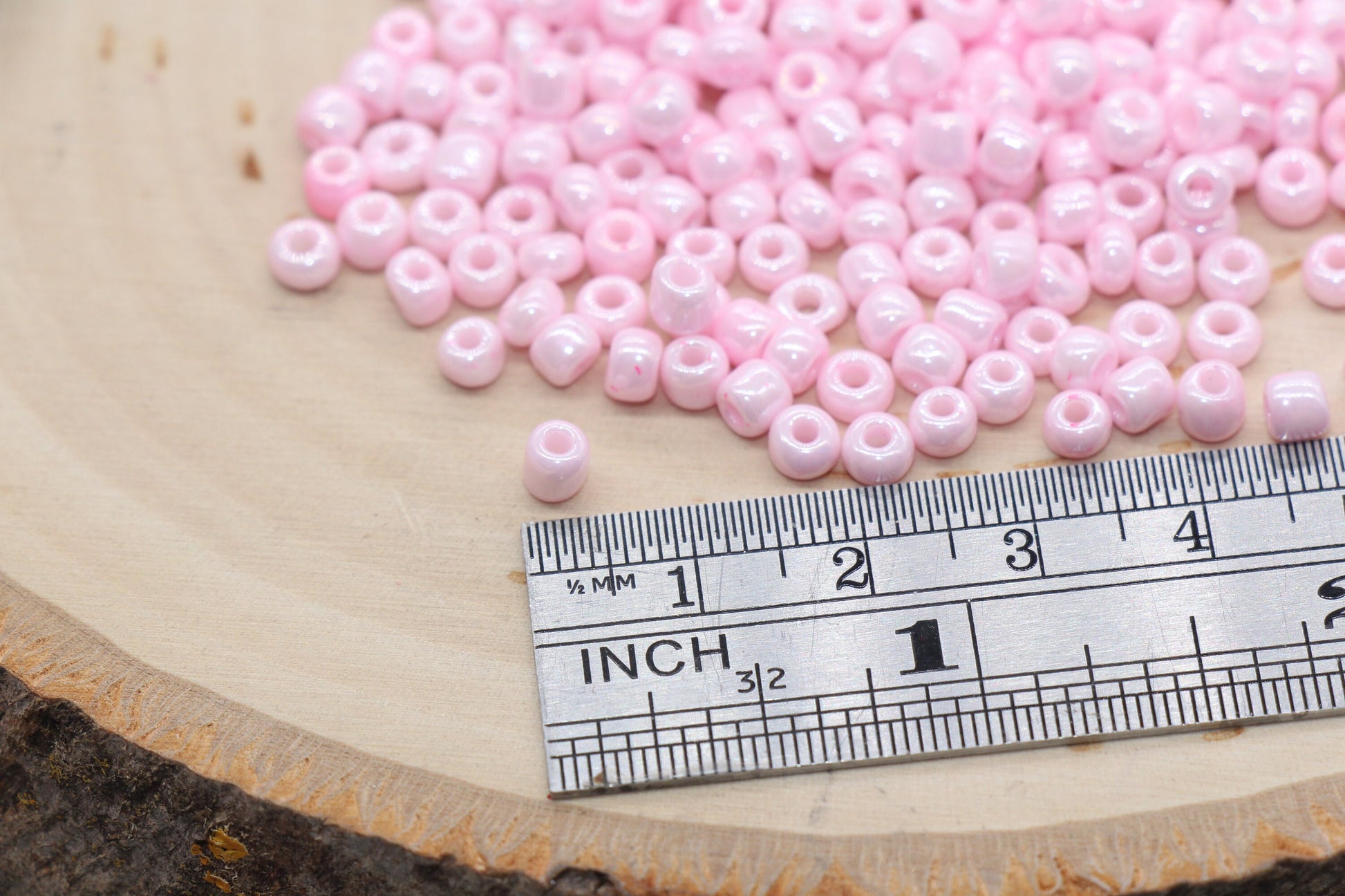 Glossy Pink Seed Beads, ideal for crafting jewelry such as bracelets and necklaces and other crafts.